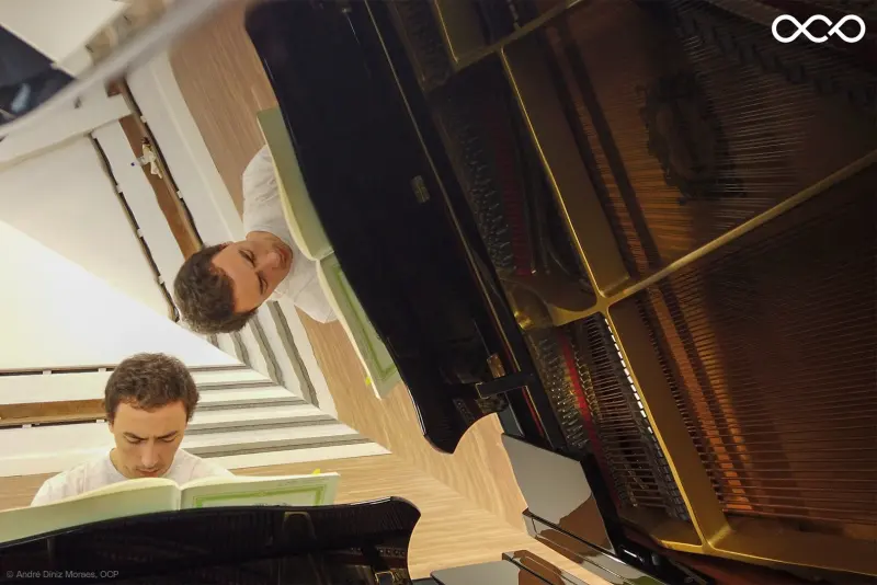 Francisco reflected in the raised lid of a grand piano